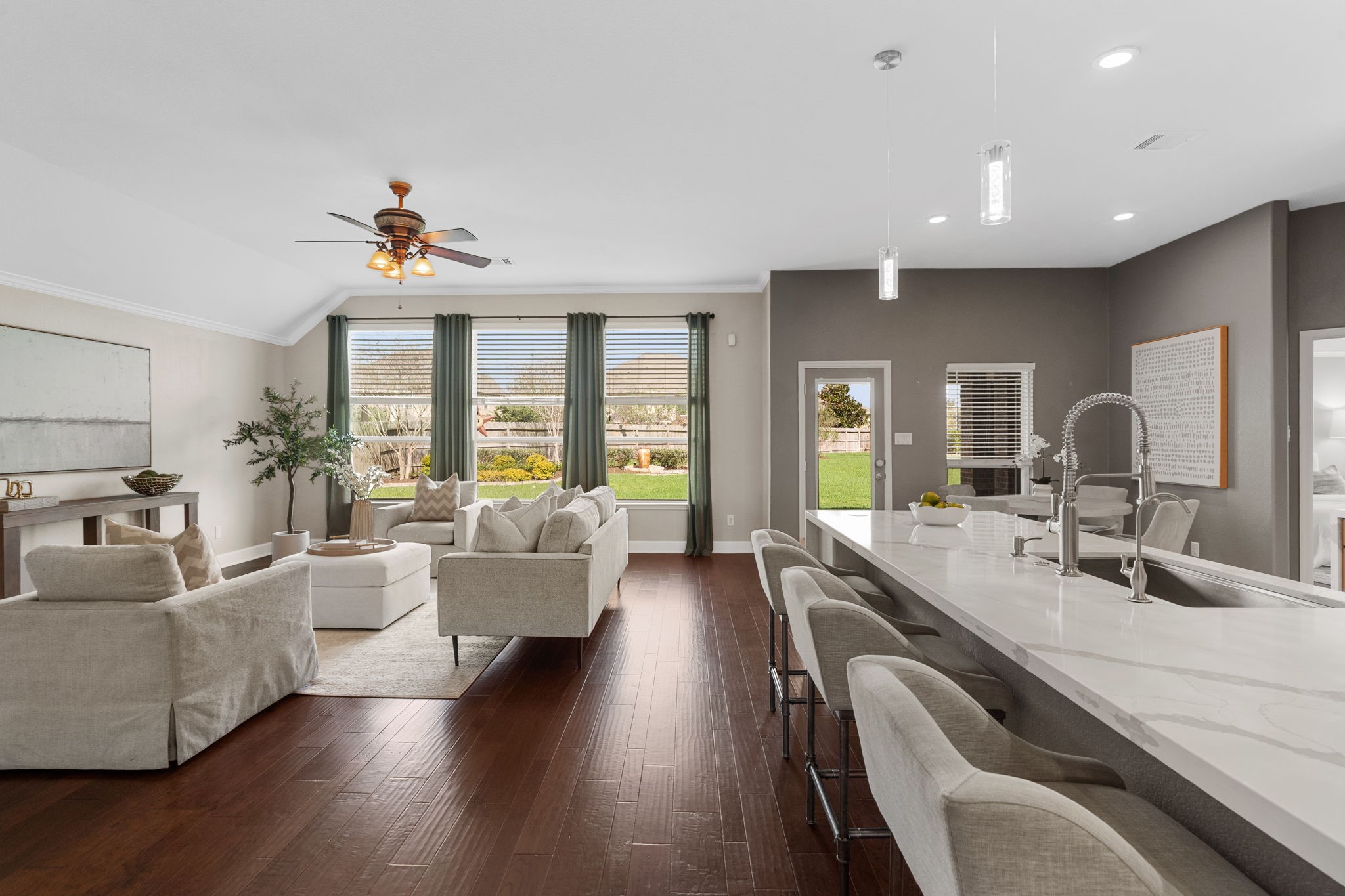 3426 Summer Ranch Drive Katy, TX 77494 - Photo 9 of 48 The open-concept living area blends comfort and style with expansive space, ideal for everyday living while staying connected to the kitchen and dining areas.