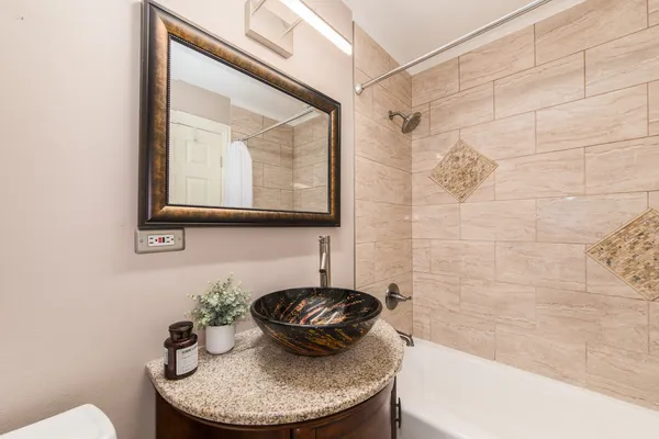 a view of a bathroom with a shower and a door