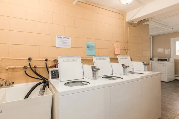 a view of a house with a yard and pathway