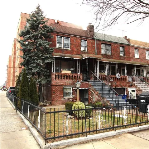 a front view of a house with parking area