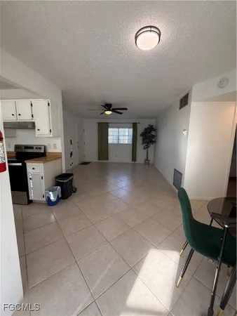 a view of a livingroom with furniture and a window