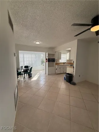 a view of kitchen with furniture and counter top