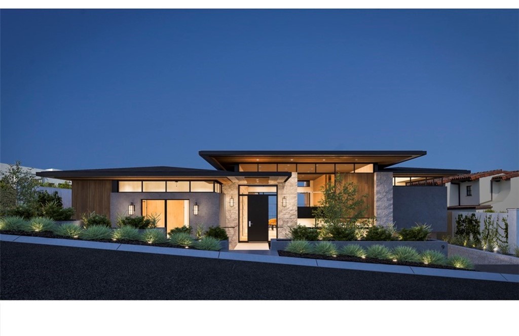 9 Pacific Ridge Place Dana Point, CA 92629 - Photo 11 of 16 a front view of a house with a garden