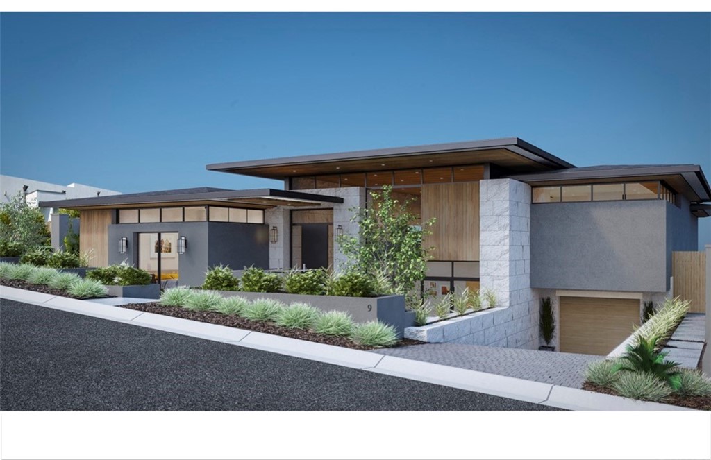 9 Pacific Ridge Place Dana Point, CA 92629 - Photo 12 of 16 a front view of a house with a yard and a garage