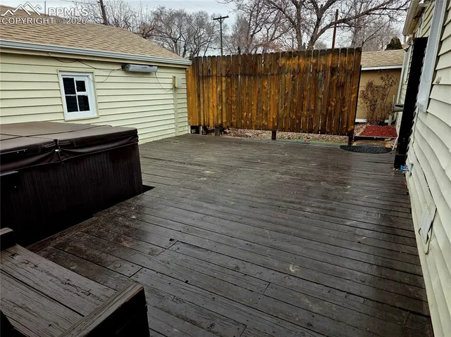 a backyard of a house with wooden floor