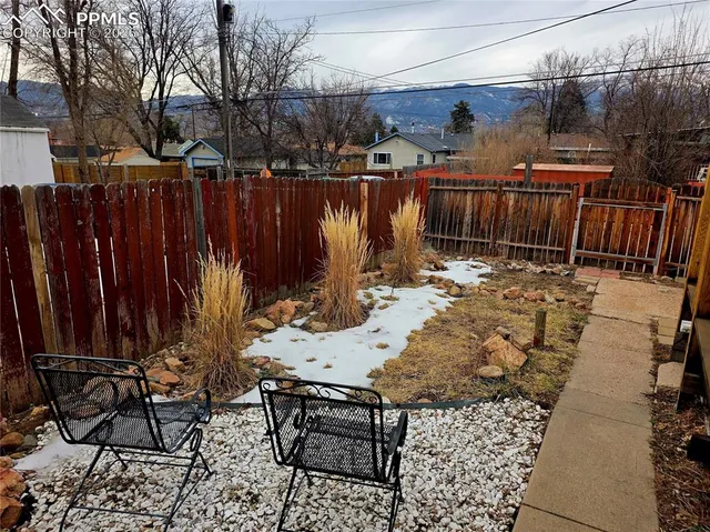 a view of a backyard with furniture