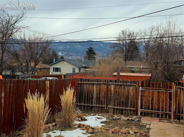 a view of a wooden fence