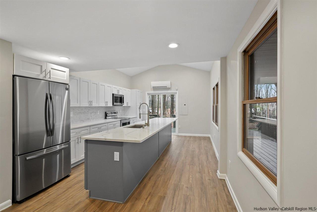 432 Plattekill Ardonia Road Wallkill, NY 12589 - Photo 7 of 35 a kitchen with stainless steel appliances a sink stove and refrigerator