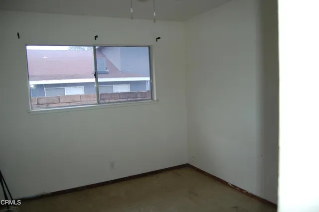 a view of a window in an empty room