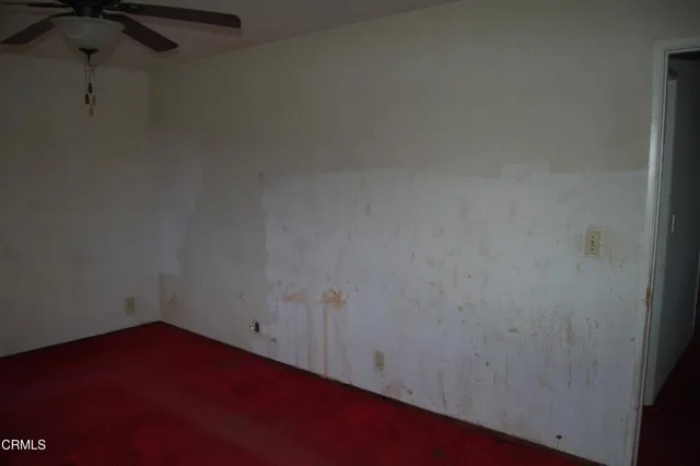 a bathroom with a granite countertop sink toilet and mirror