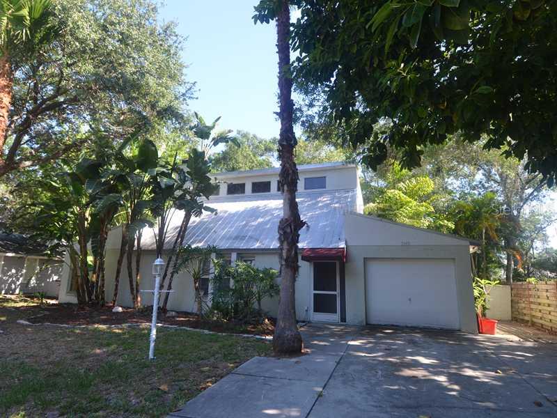 7163 Jarvis Road Sarasota, FL 34241 - Photo 1 of 1 front view of a house with a tree