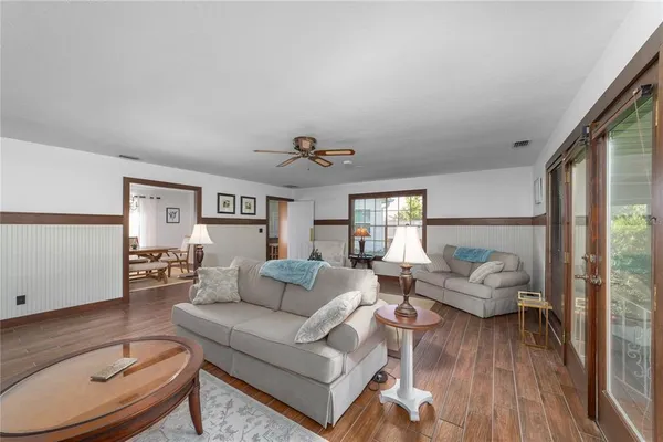 a living room with furniture and a large window