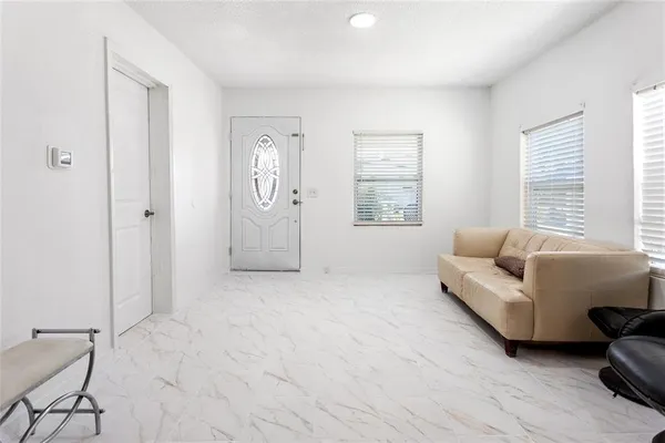 a living room with furniture and a window