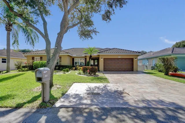 a front view of a house with a yard and porch