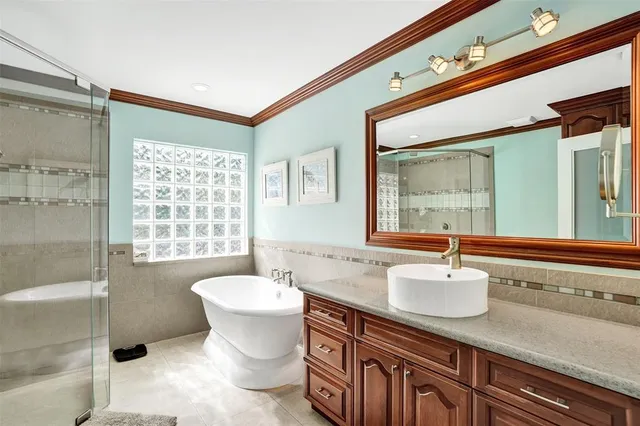 a bedroom with a bed and a desk