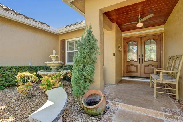 a living room with furniture fireplace and large window