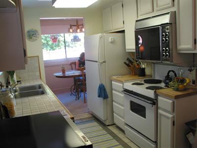 4 Linnet Court San Rafael, CA 94903 - Photo 3 of 12 a kitchen with a stove a refrigerator and a sink