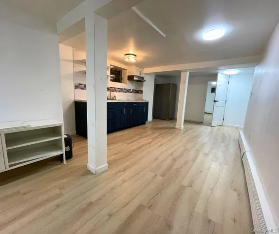 a view of kitchen with cabinets