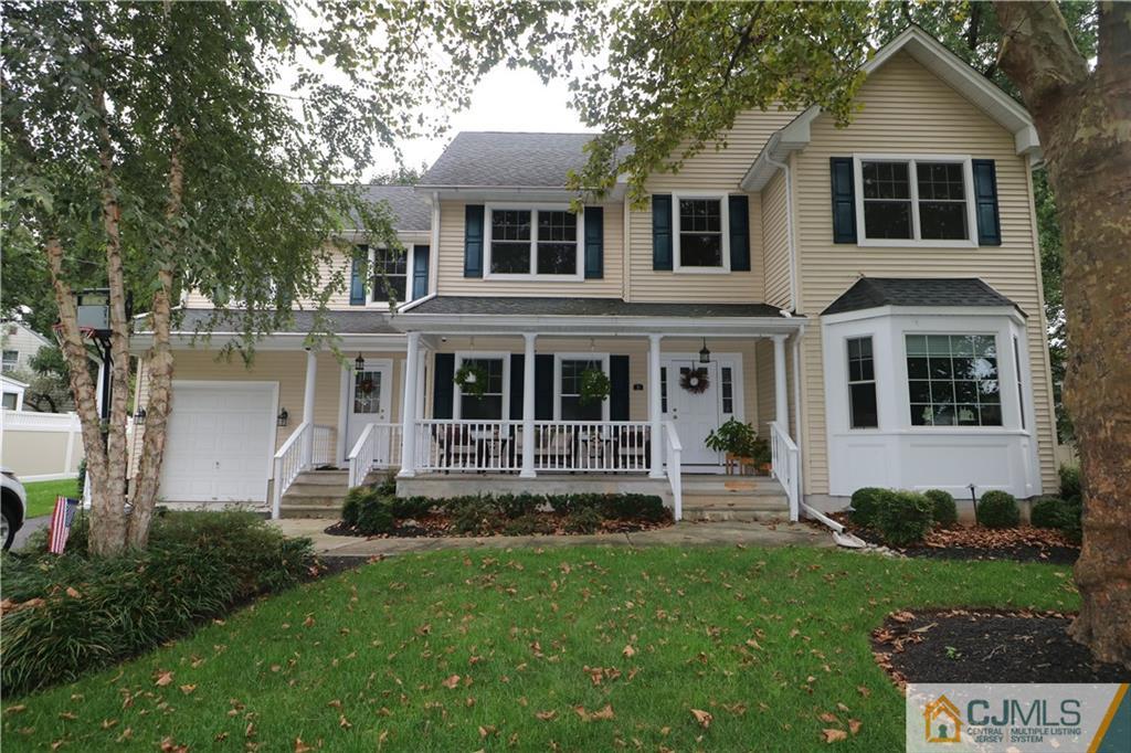 70 Willow Road Metuchen, NJ 08840 - Photo 1 of 25 a front view of a house with a yard
