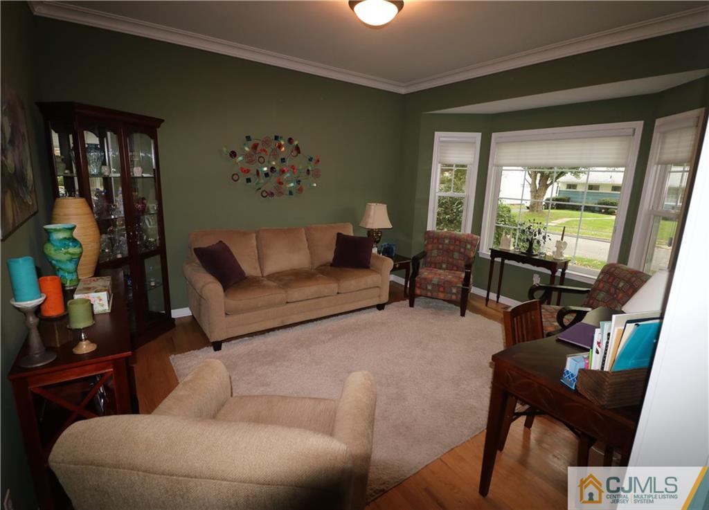 70 Willow Road Metuchen, NJ 08840 - Photo 4 of 25 a living room with furniture and a floor to ceiling window