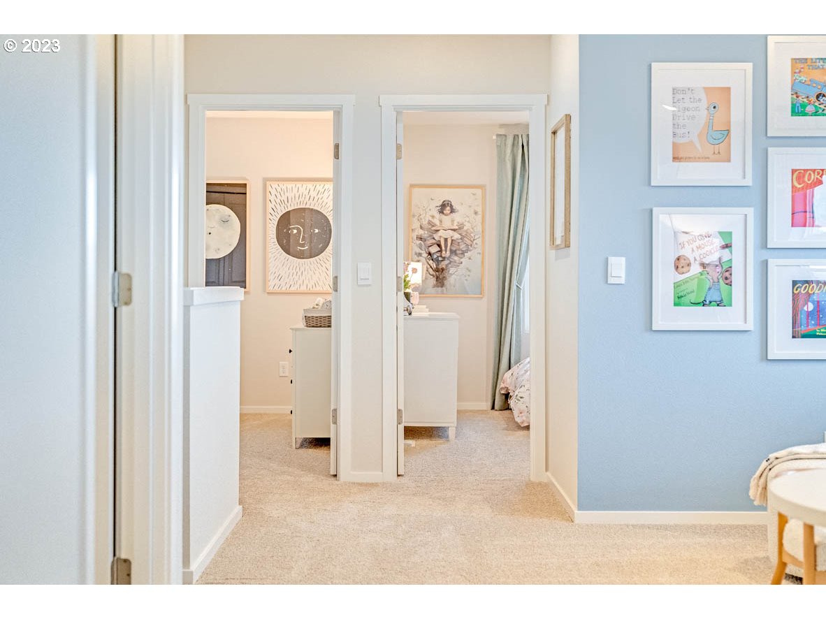 819 Northwest 175th Way Ridgefield, WA 98642 - Photo 15 of 26 a living room with a hallway and wooden floor