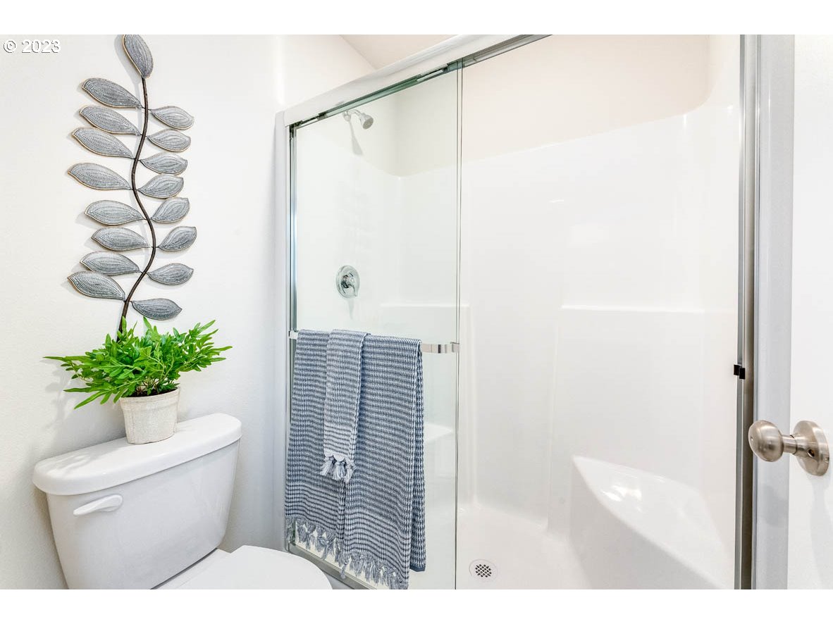 819 Northwest 175th Way Ridgefield, WA 98642 - Photo 24 of 26 a bathroom with a sink toilet and shower