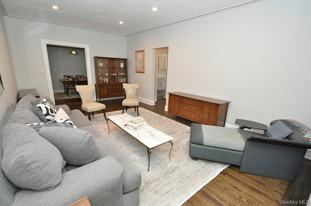 143 Garth Road, Unit 4P Scarsdale, NY 10583 - Photo 5 of 44 Bright and Sunny living room overlooks Garth Woods and has recessed lighting and hardwood floors.