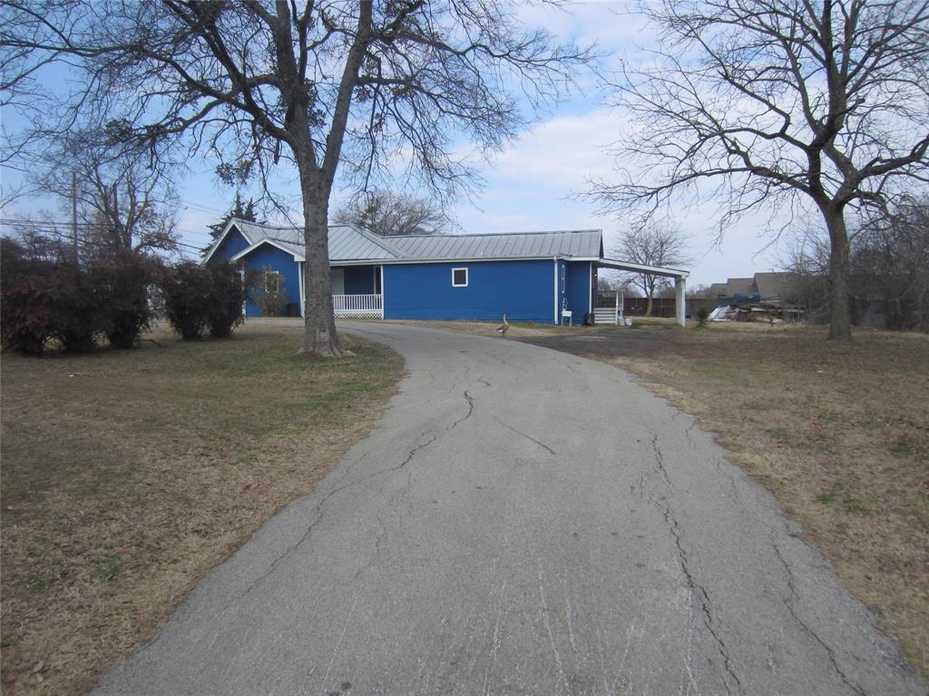 1004 Church Street Sulphur Springs, TX 75482 - Photo 14 of 38 a house with trees in front of it