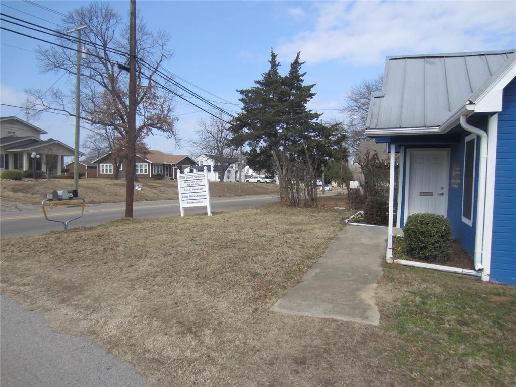 1004 Church Street Sulphur Springs, TX 75482 - Photo 15 of 38 a view of a street with some trees on both side of it