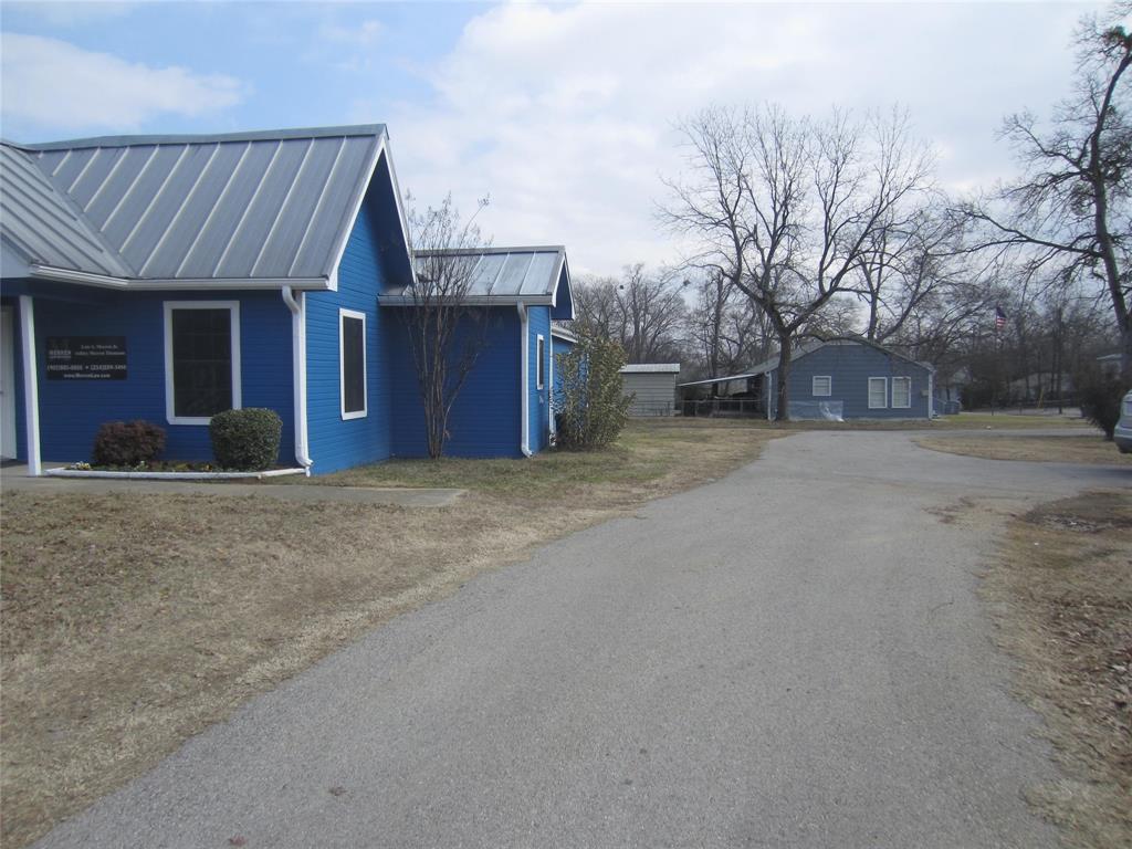 1004 Church Street Sulphur Springs, TX 75482 - Photo 16 of 38 a view of a house with a yard