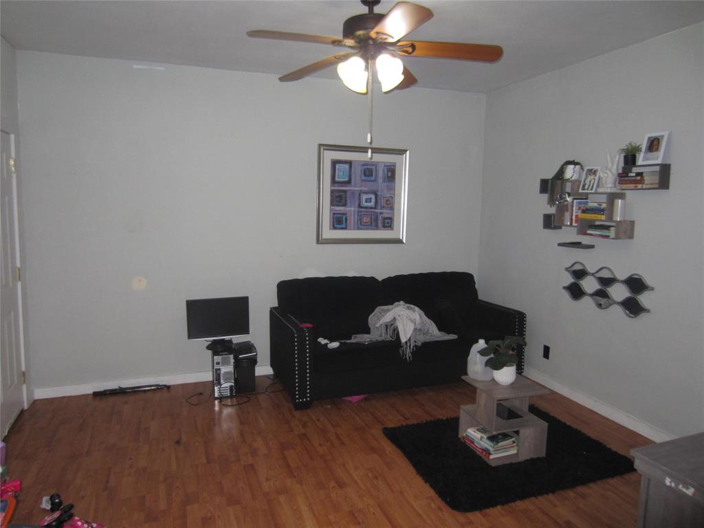 1004 Church Street Sulphur Springs, TX 75482 - Photo 33 of 38 a living room with furniture and wooden floor