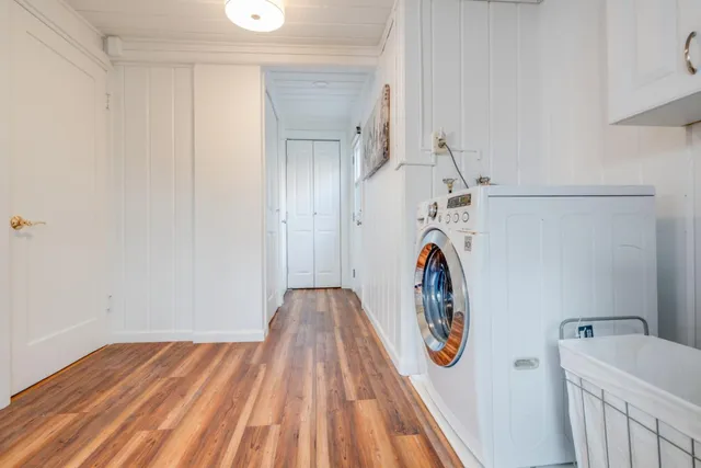 a view of front door with wooden floor