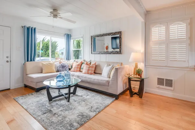 a living room with furniture and a rug