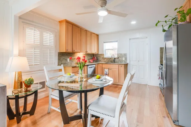 a view of a dining room with furniture window and outside view