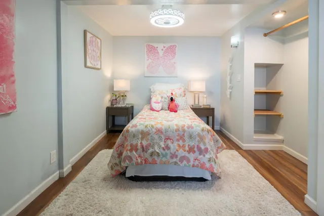 a bedroom with a bed and a walk in closet