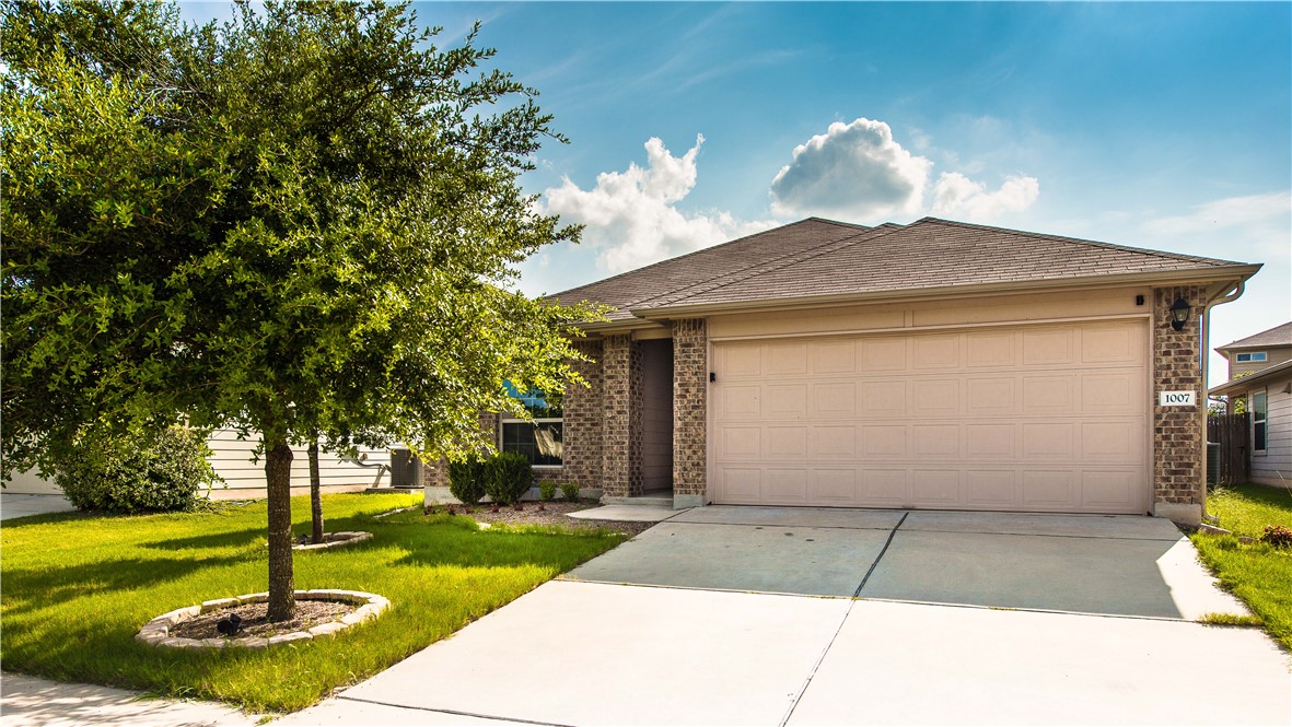 1007 Plateau Trail Georgetown, TX 78626 - Photo 2 of 32 a front view of a house with a yard