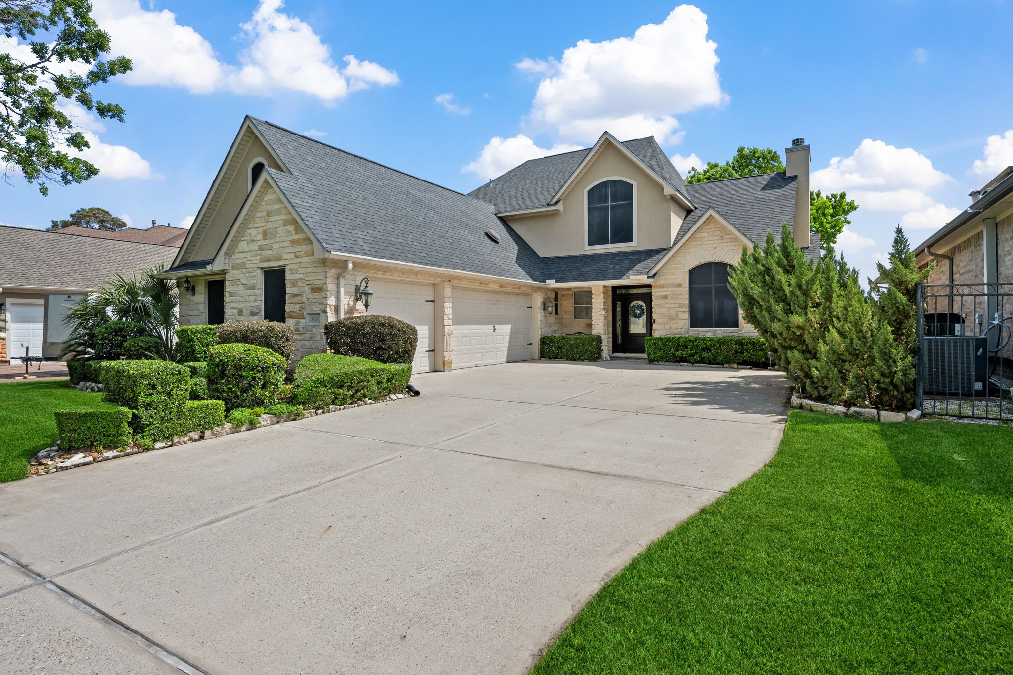 a front view of a house with garden