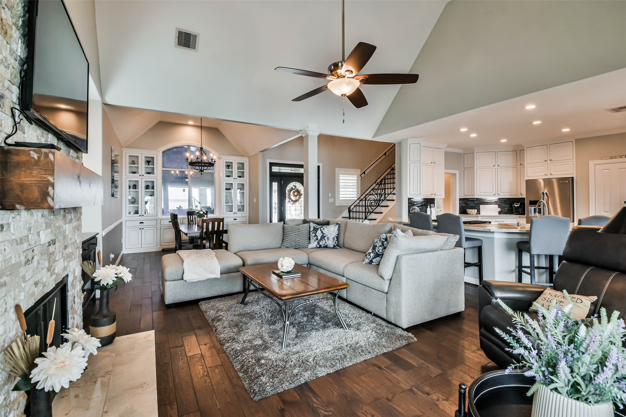 19022 Vantage View Lane Houston, TX 77346 - Photo 11 of 38 a living room with fireplace furniture and a chandelier