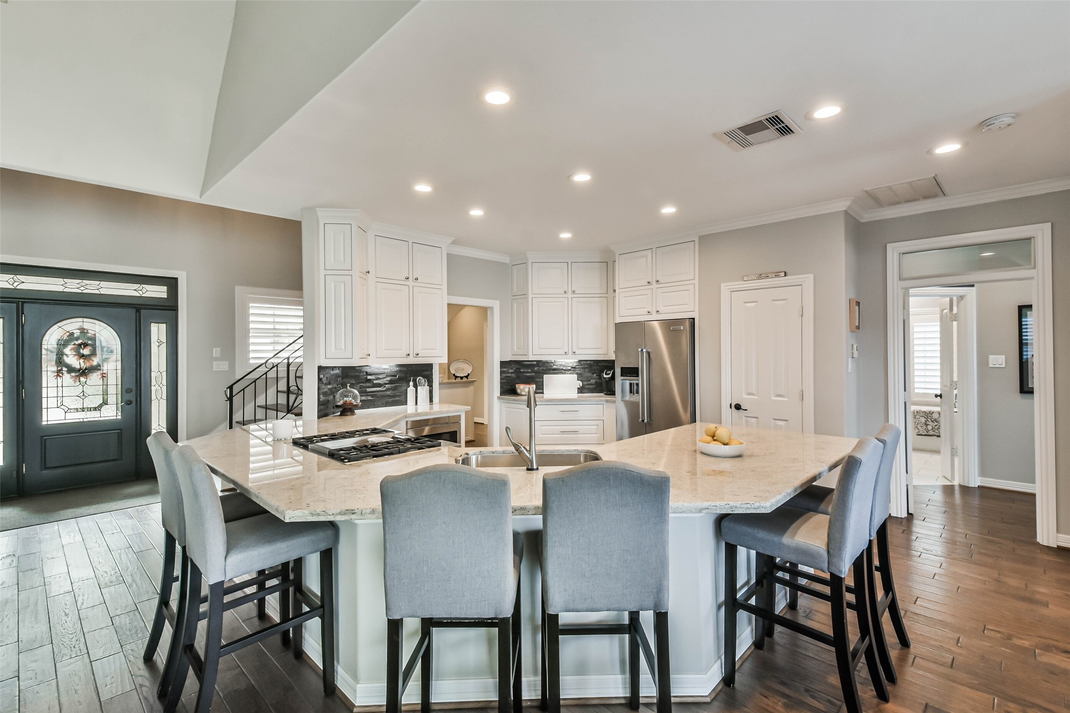 19022 Vantage View Lane Houston, TX 77346 - Photo 13 of 38 a dining room with stainless steel appliances kitchen island granite countertop a dining table chairs and a refrigerator