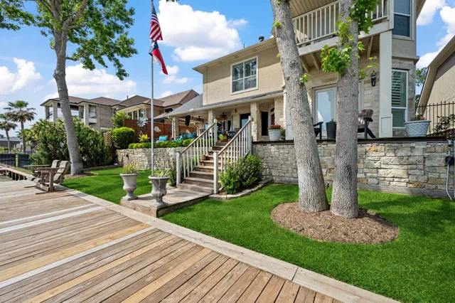 a front view of a house with a yard table and chairs