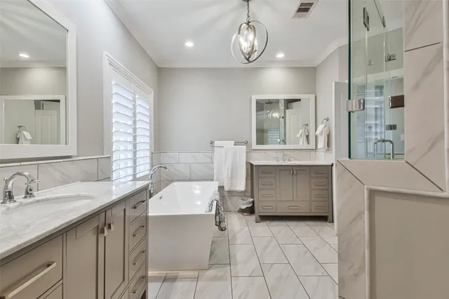 a bathroom with a sink a vanity and a large mirror