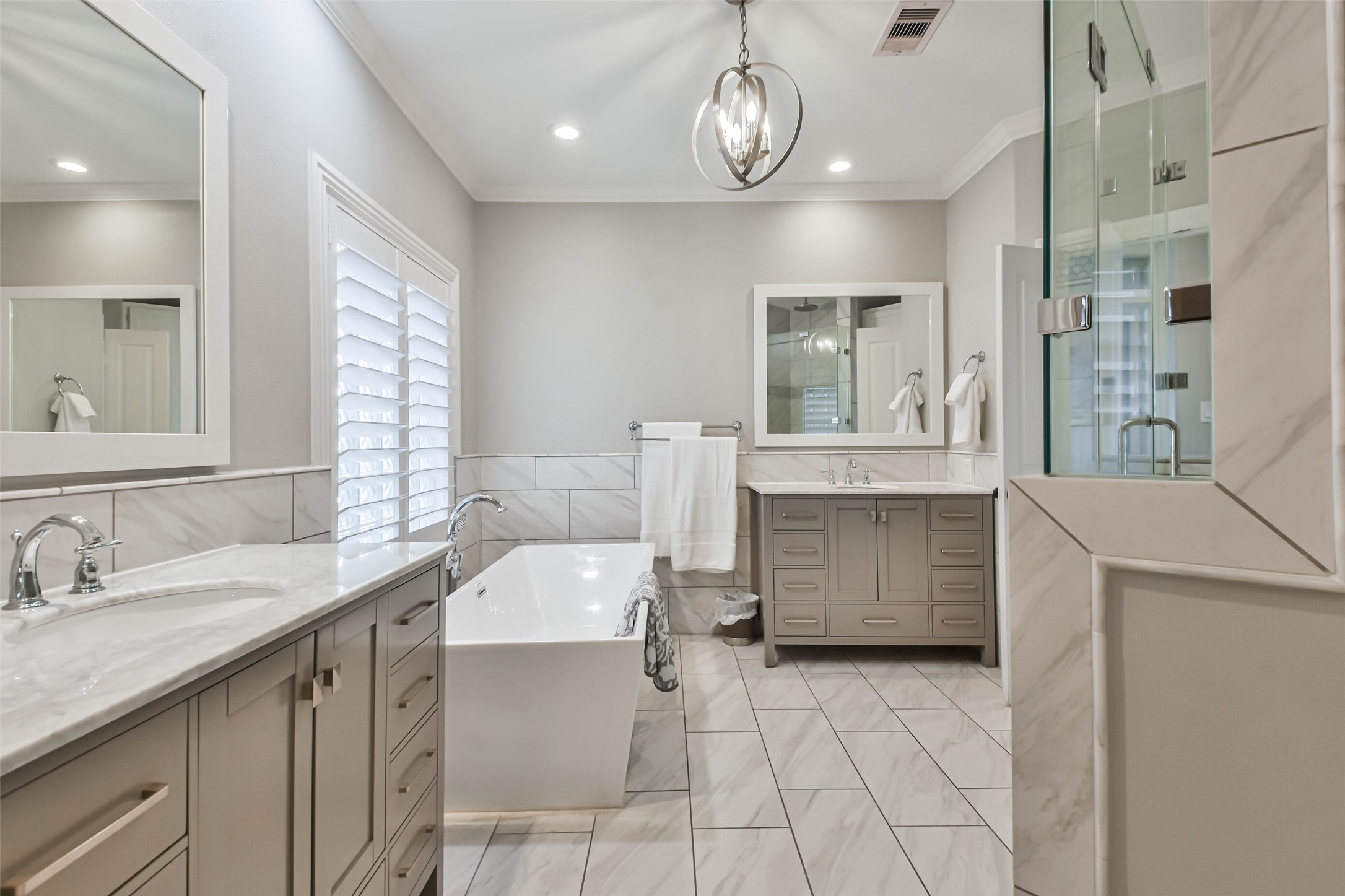 19022 Vantage View Lane Houston, TX 77346 - Photo 21 of 38 a bathroom with a sink a vanity and a large mirror