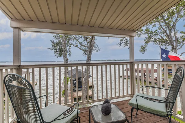 a view of a balcony with furniture