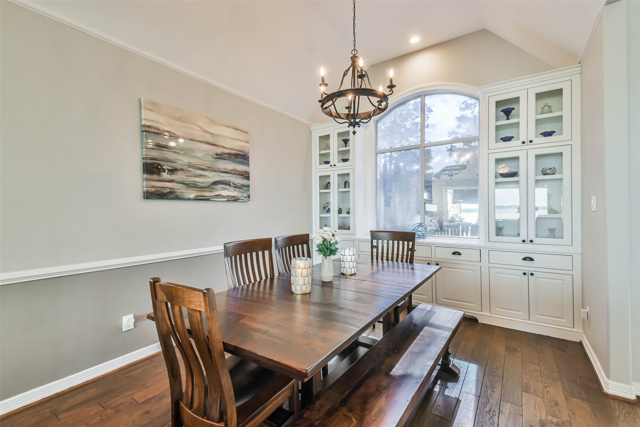 19022 Vantage View Lane Houston, TX 77346 - Photo 7 of 38 a view of a dining room with furniture a chandelier and wooden floor