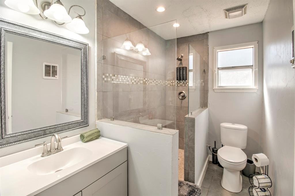 374 Hideaway Lane Valley View, TX 76272 - Photo 14 of 35 Step in shower with sink and vanity.