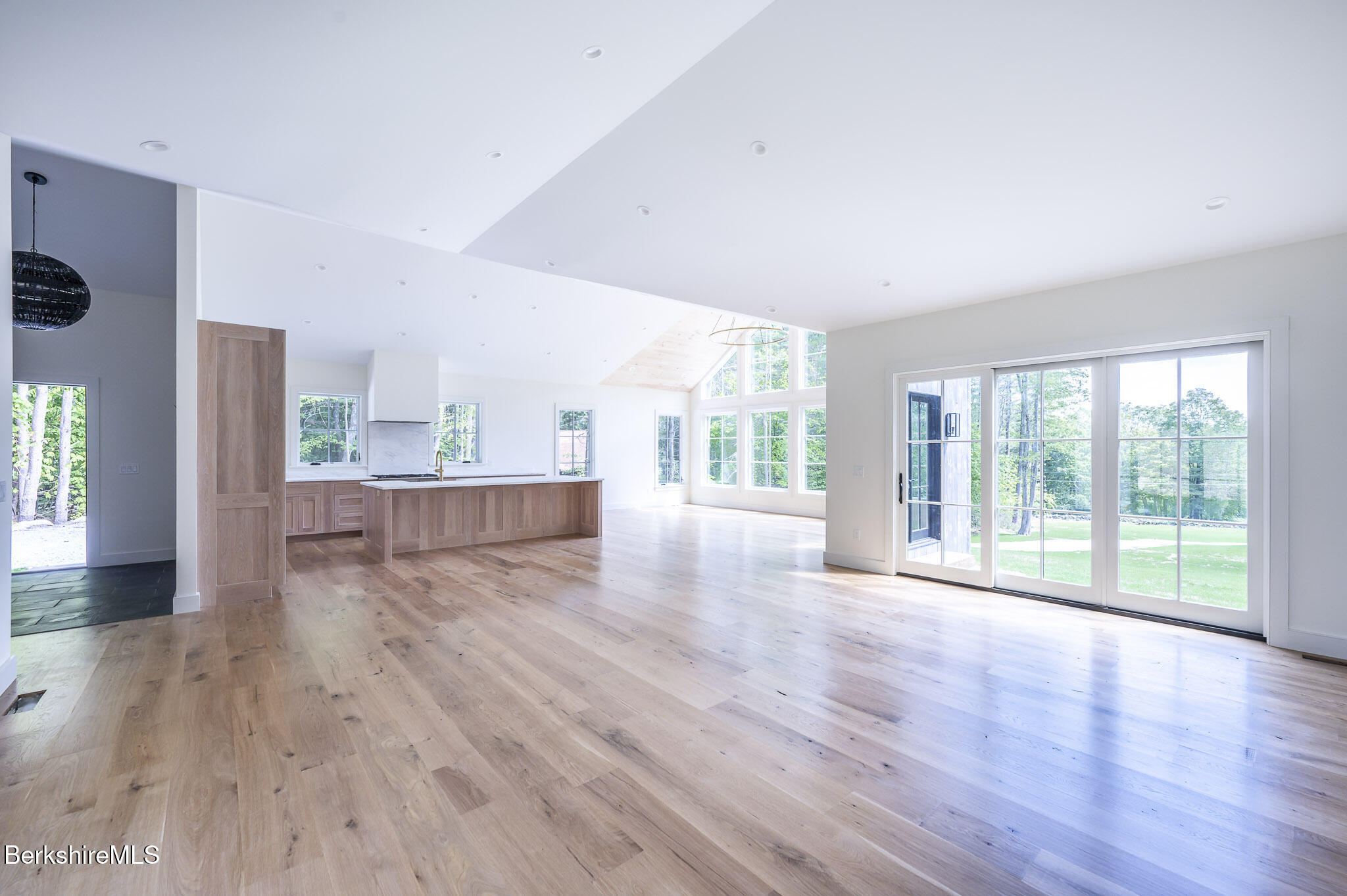 414 South Undermountain Road Sheffield, MA 01257 - Photo 11 of 37 a view of an empty room with wooden floor and a window