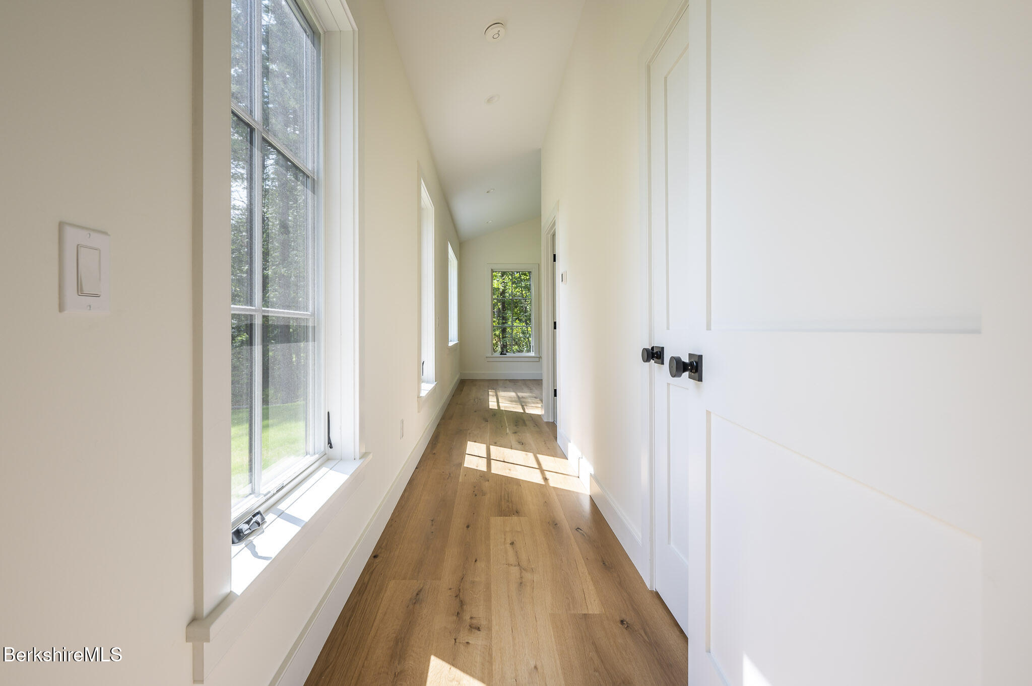 414 South Undermountain Road Sheffield, MA 01257 - Photo 17 of 37 a view of a hallway with wooden floor and staircase