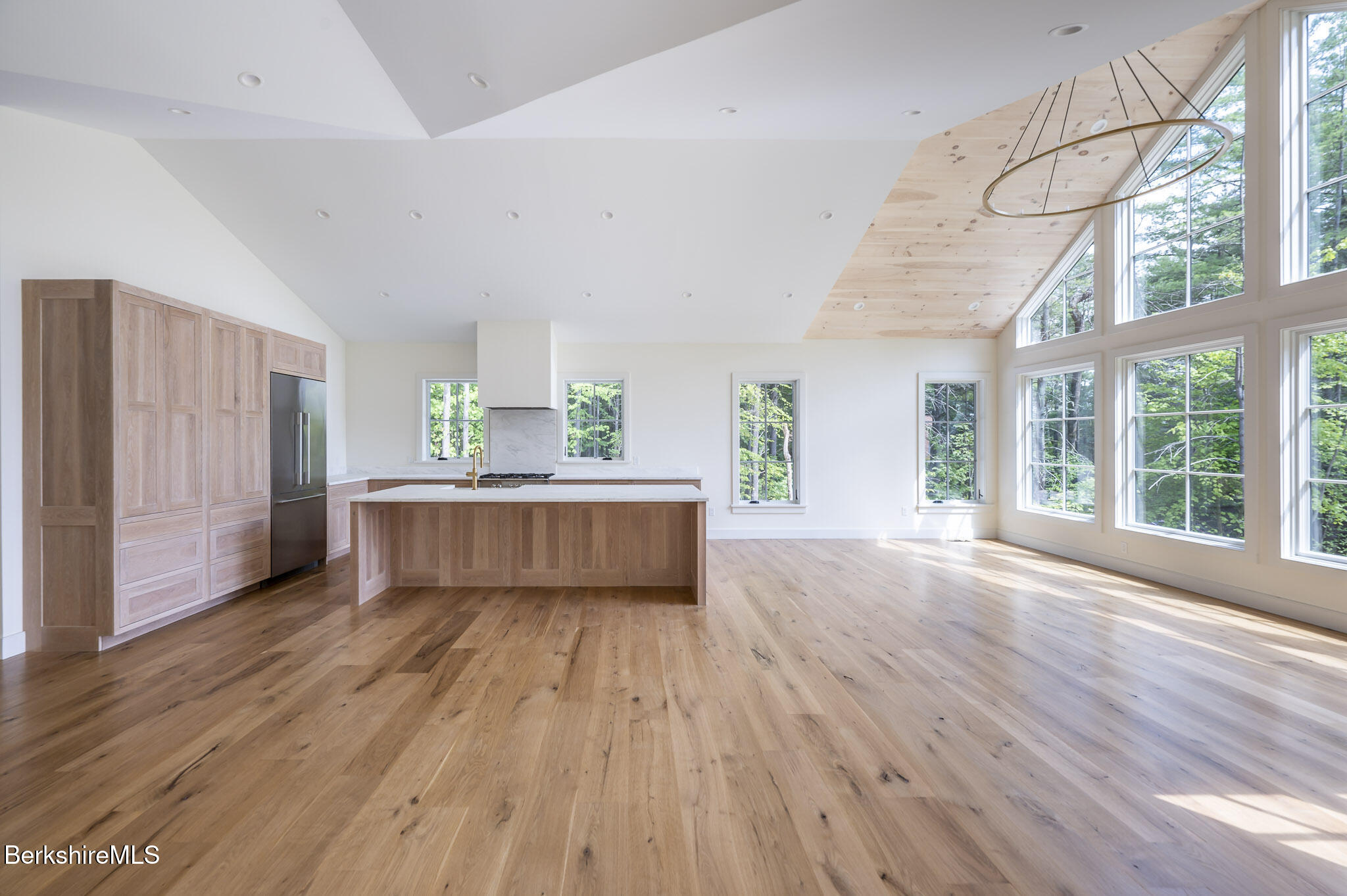 414 South Undermountain Road Sheffield, MA 01257 - Photo 23 of 37 a living room with a kitchen island wooden floor and window
