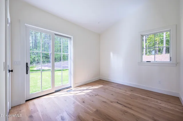 a view of a house with a yard patio and fire pit