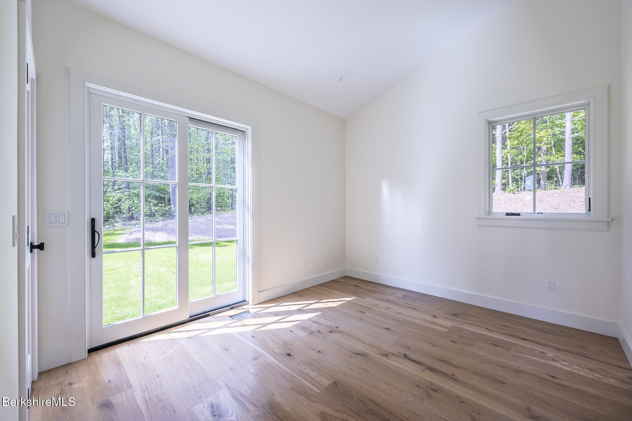 414 South Undermountain Road Sheffield, MA 01257 - Photo 27 of 37 a view of an empty room with wooden floor and a window